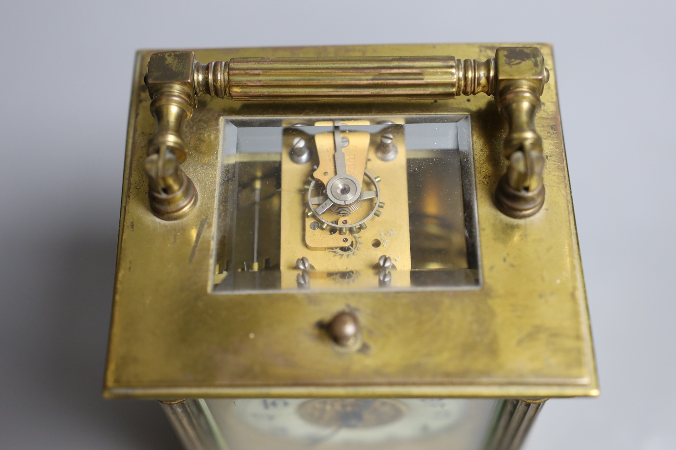 A French quarter repeating gilt brass carriage clock, 14 cms high